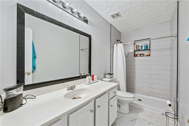 642 Towering Pine Trl, Lawrenceville, GA 30045 - full bath featuring a stall shower, vanity, toilet, a textured ceiling, and marble finish flooring