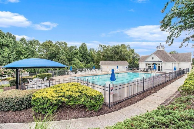 642 Towering Pine Trl, Lawrenceville, GA 30045 - community pool featuring fence and a patio area
