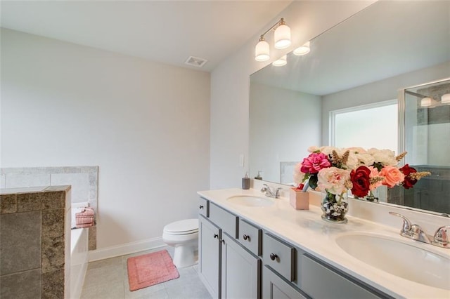 bathroom with a stall shower, a sink, visible vents, and tile patterned floors