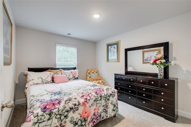 bedroom with carpet flooring and baseboards