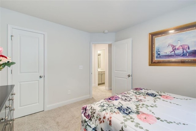 bedroom with light carpet and baseboards