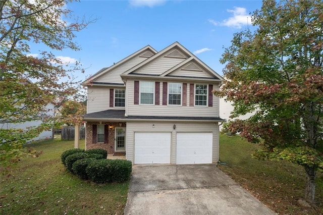 view of front of house featuring a garage and a front lawn