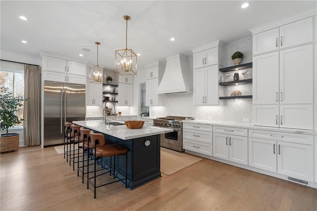 120 Nezhat Pl, Sandy Springs, GA 30350 - kitchen with premium appliances, open shelves, custom range hood, a sink, and recessed lighting