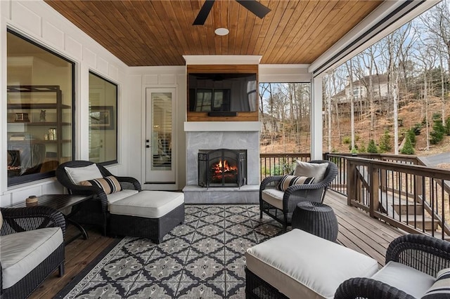 120 Nezhat Pl, Sandy Springs, GA 30350 - sunroom / solarium with a ceiling fan and an outdoor living space with a fireplace