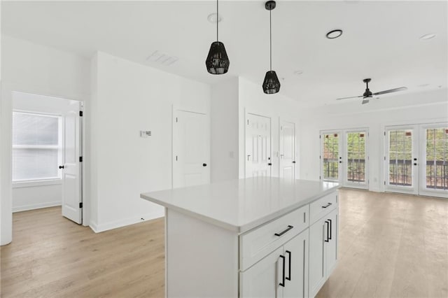 1500 Murphy Ave SW, Atlanta, GA 30310 - kitchen featuring light wood-style flooring, french doors, a ceiling fan, decorative light fixtures, and open floor plan