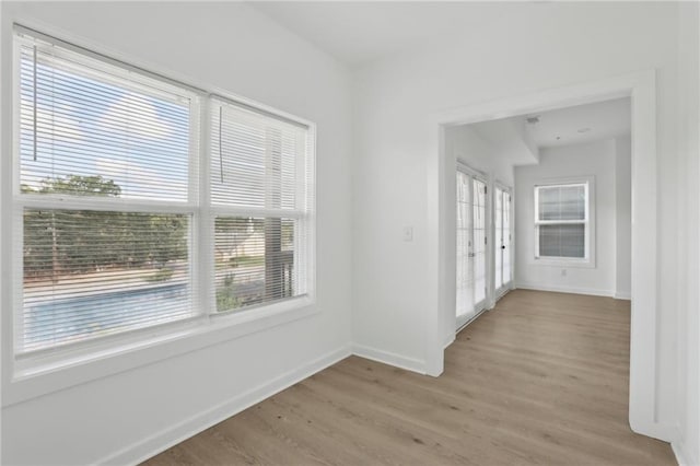 1500 Murphy Ave SW, Atlanta, GA 30310 - empty room with plenty of natural light, baseboards, and light wood-style flooring