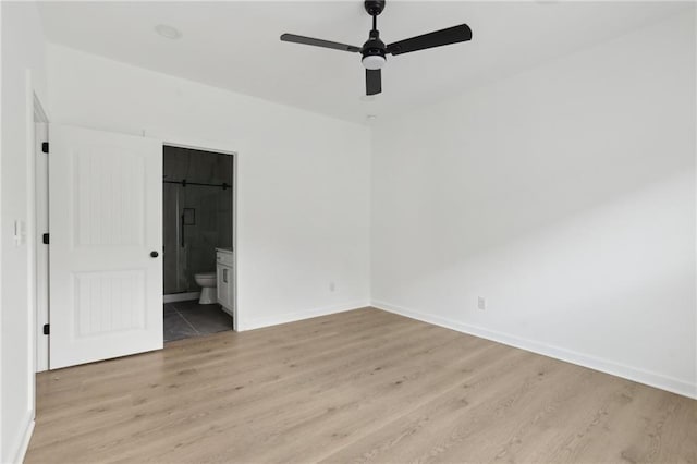 1500 Murphy Ave SW, Atlanta, GA 30310 - unfurnished bedroom with light wood-style floors, baseboards, ensuite bath, and ceiling fan