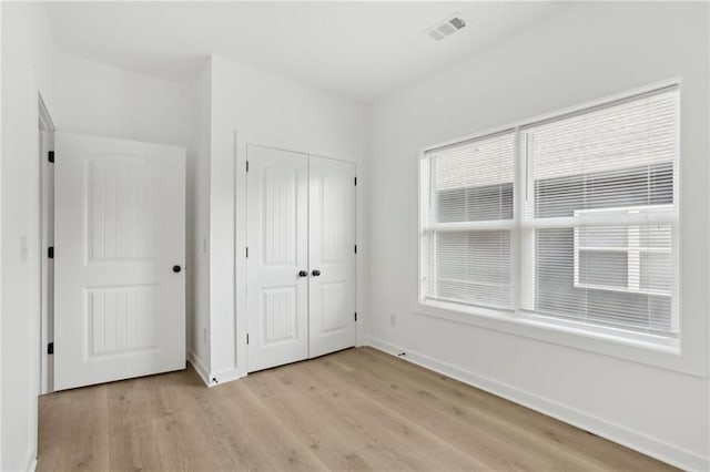 1500 Murphy Ave SW, Atlanta, GA 30310 - unfurnished bedroom featuring light wood-style flooring, baseboards, and a closet