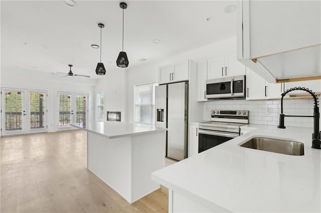 1500 Murphy Ave SW, Atlanta, GA 30310 - kitchen with stainless steel appliances, a sink, a kitchen island, healthy amount of natural light, and recessed lighting