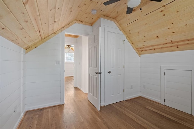 additional living space with wooden ceiling, wood finished floors, vaulted ceiling, and a ceiling fan