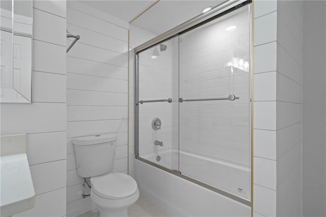 bathroom with toilet and enclosed tub / shower combo