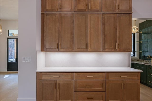 kitchen with pendant lighting, a wealth of natural light, and sink