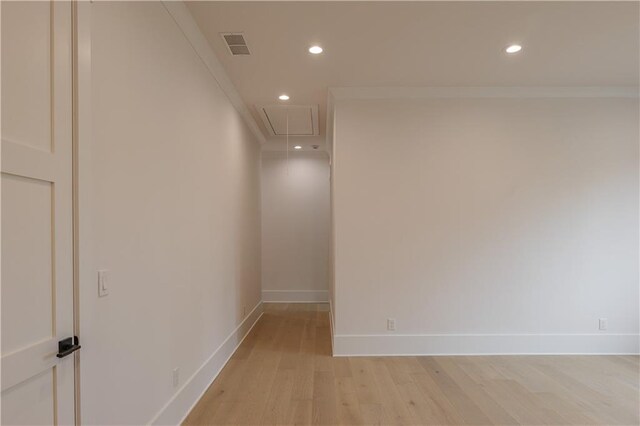 empty room featuring a wealth of natural light and light hardwood / wood-style flooring