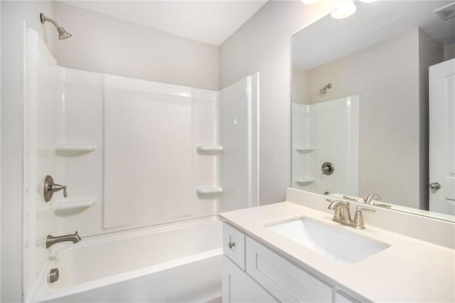 bathroom featuring tub / shower combination and vanity