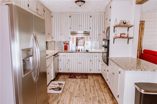4625 Ben Hill Dr, Oakwood, GA 30566 - kitchen with appliances with stainless steel finishes, a sink, under cabinet range hood, light wood finished floors, and light stone countertops