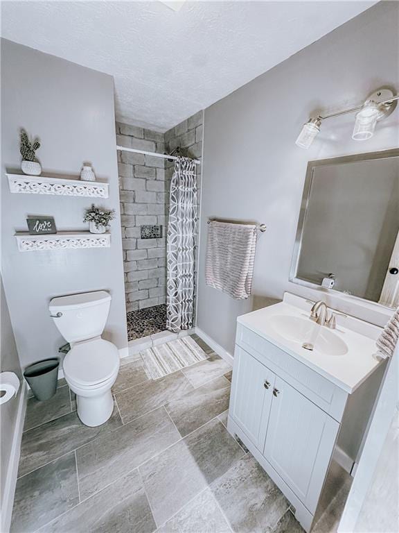 4625 Ben Hill Dr, Oakwood, GA 30566 - bathroom with a shower stall, toilet, vanity, baseboards, and a textured ceiling