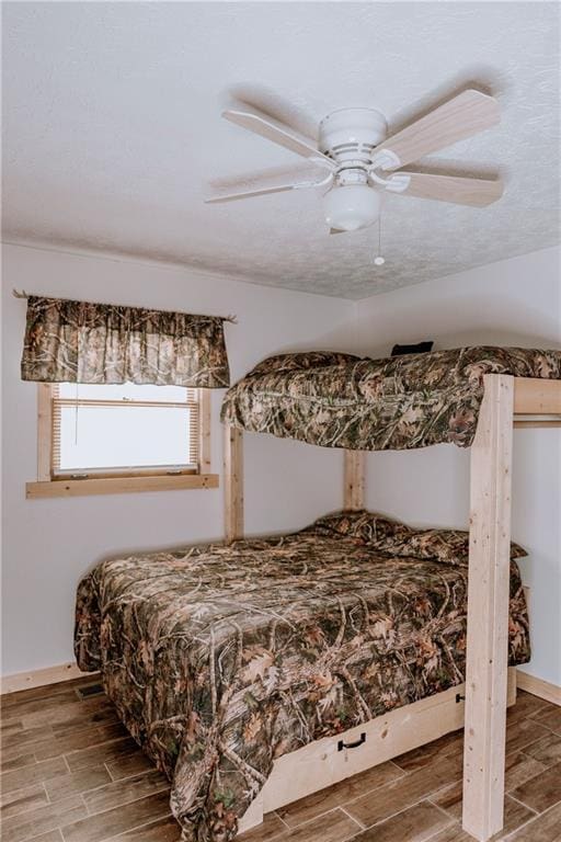 4625 Ben Hill Dr, Oakwood, GA 30566 - bedroom featuring wood tiled floors, a ceiling fan, and baseboards
