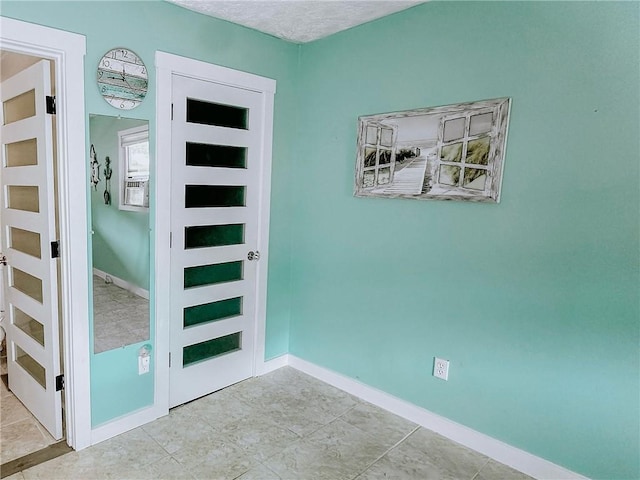 4625 Ben Hill Dr, Oakwood, GA 30566 - foyer featuring baseboards and tile patterned floors