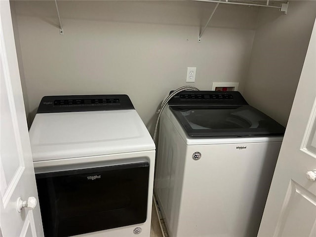 clothes washing area with independent washer and dryer