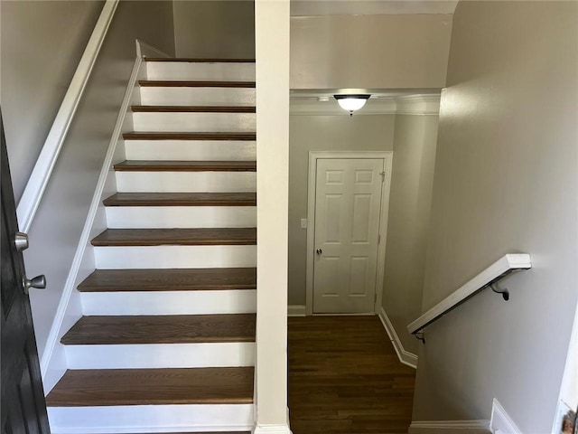 stairway featuring hardwood / wood-style flooring