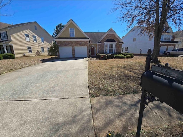 view of front facade with concrete driveway, stone siding, and an attached garage