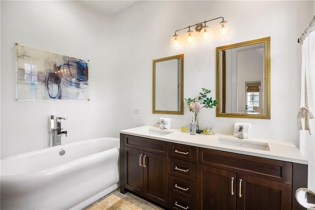 bathroom featuring a sink, a soaking tub, and double vanity