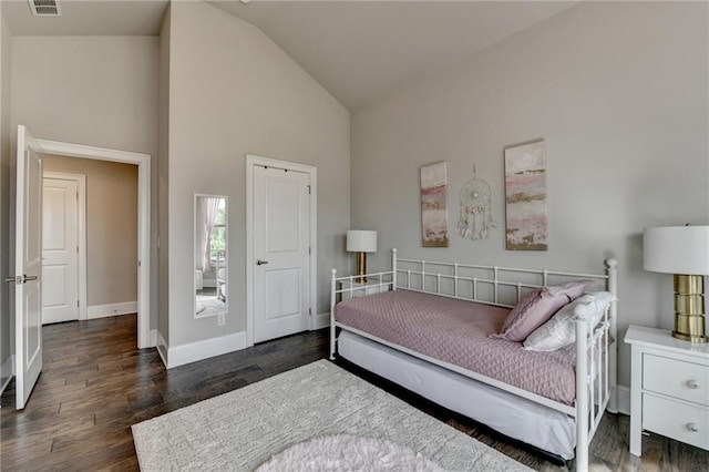3925 Sierra Knolls Ct, Cumming, GA 30040 - bedroom with high vaulted ceiling, baseboards, and wood finished floors