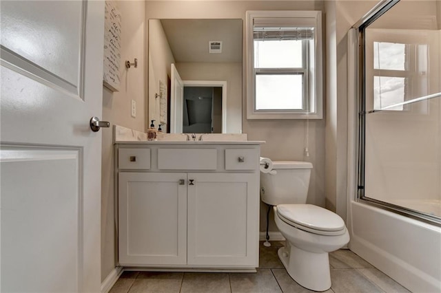 3925 Sierra Knolls Ct, Cumming, GA 30040 - bathroom featuring toilet, tile patterned flooring, vanity, baseboards, and enclosed tub / shower combo