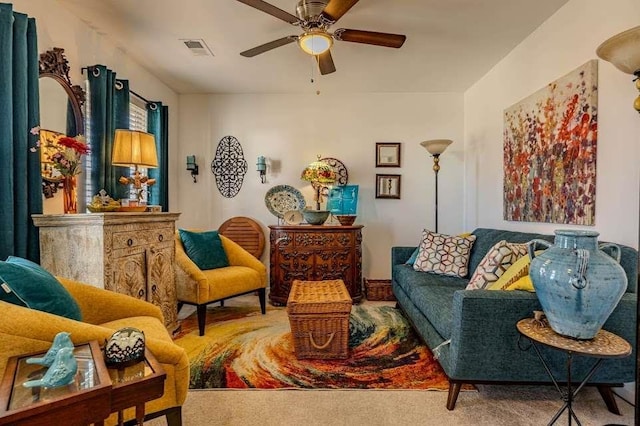 living area with carpet floors and ceiling fan