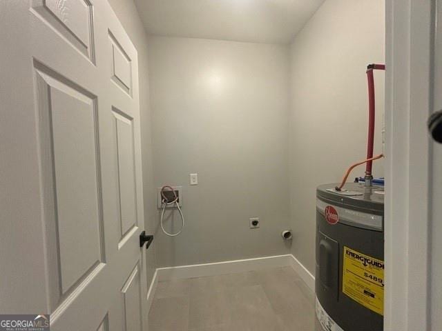 laundry room featuring electric water heater and hookup for an electric dryer