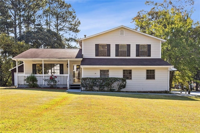 split level home featuring covered porch and a front yard