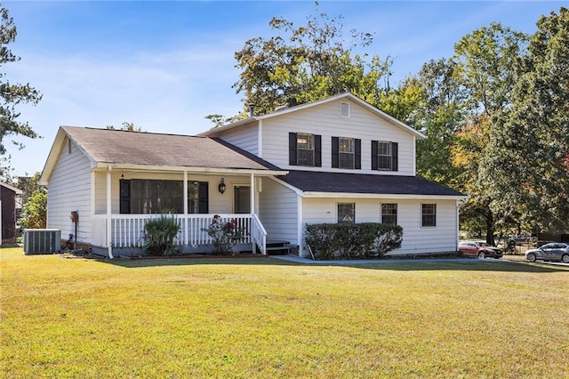 view of front of property with a front yard, a porch, and cooling unit