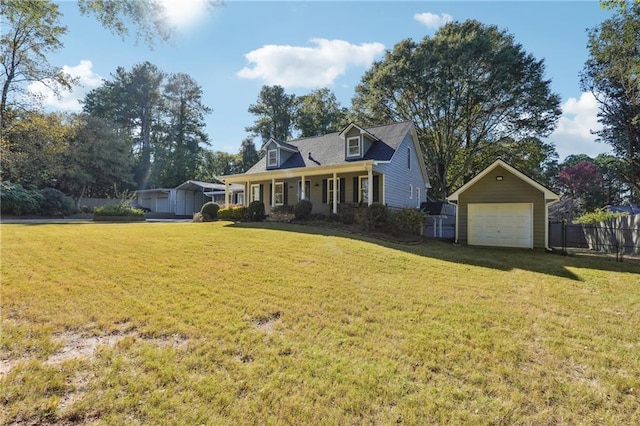 cape cod-style house with a front yard, an outdoor structure, and a porch