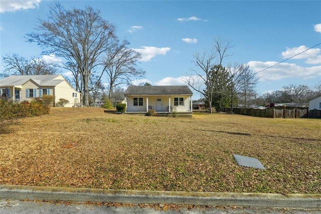 view of front of property with a front yard and a porch