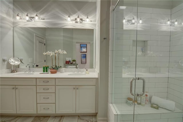 bathroom featuring a stall shower and double vanity