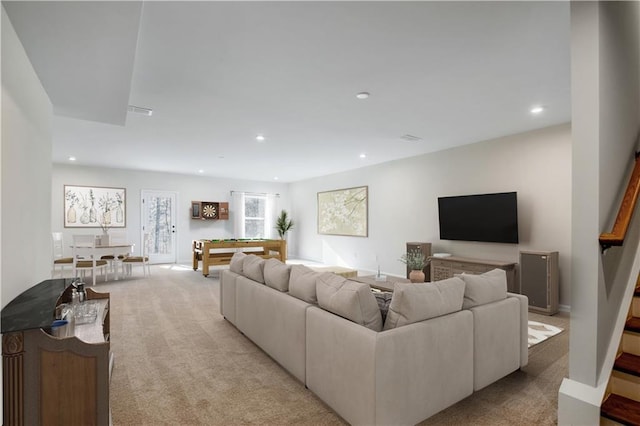 living room with light colored carpet and billiards