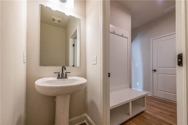 bathroom with sink and hardwood / wood-style flooring