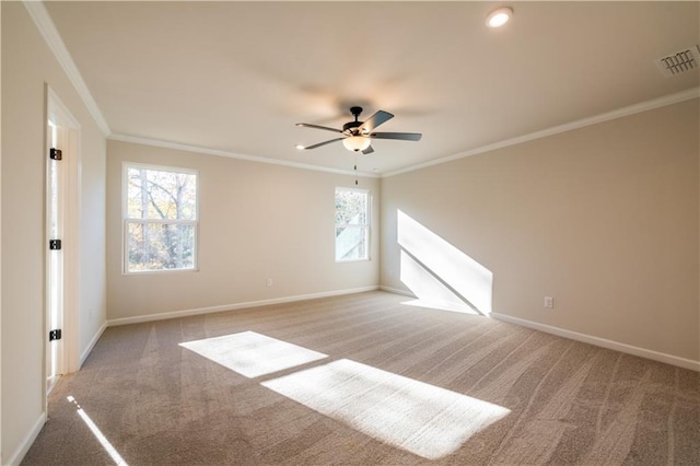 unfurnished room with crown molding, light colored carpet, and ceiling fan