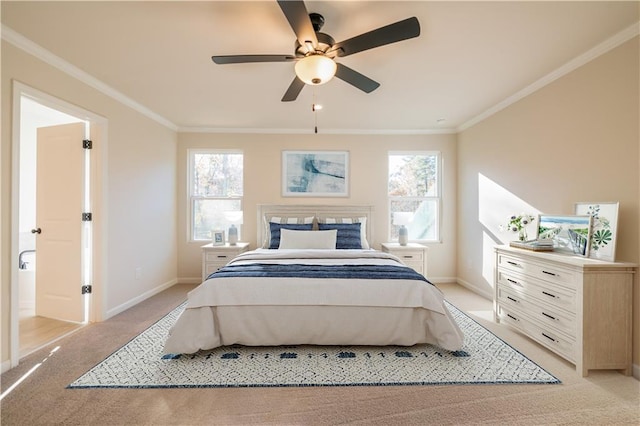 bedroom with crown molding, light colored carpet, and ceiling fan