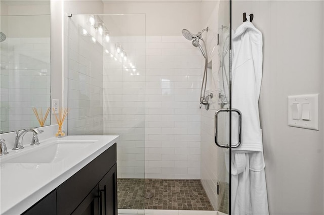 bathroom with vanity and a shower stall