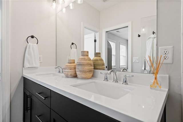 full bath featuring a sink and double vanity