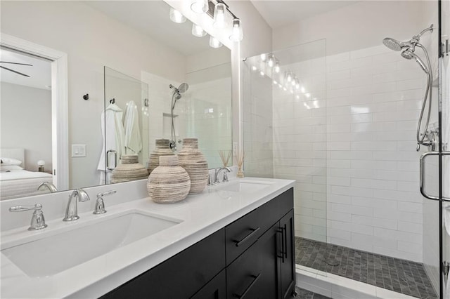 ensuite bathroom with a stall shower, ensuite bath, and a sink