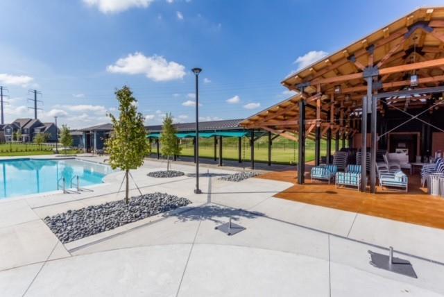 view of pool featuring a patio area and a fenced in pool