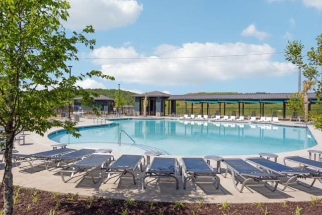 community pool with a patio area