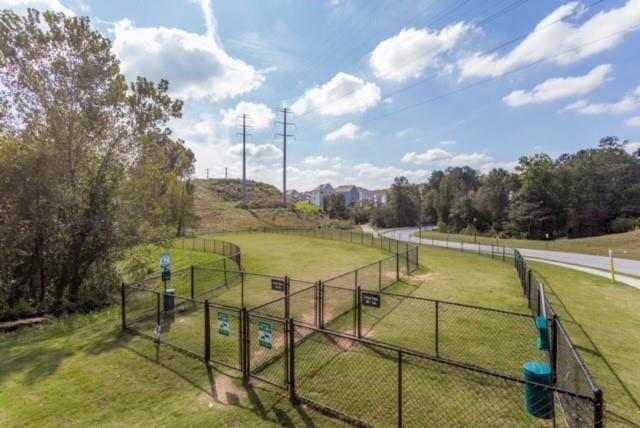 view of yard featuring a rural view and fence