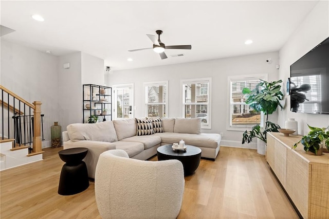 living area with light wood finished floors, stairway, recessed lighting, and visible vents