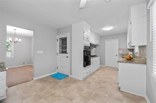 4094 Colgate Way, Decatur, GA 30034 - kitchen with a warming drawer, backsplash, stone counters, and white cabinetry