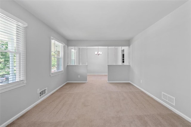4094 Colgate Way, Decatur, GA 30034 - unfurnished room featuring a chandelier and light colored carpet