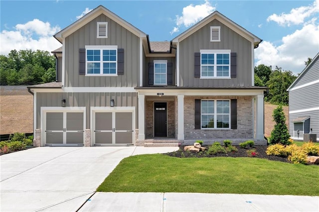 view of front of property featuring a garage and a front yard