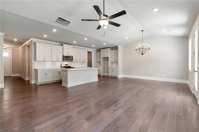 329 Willow Cv, Canton, GA 30114 - kitchen featuring baseboards, visible vents, lofted ceiling, stainless steel appliances, and ceiling fan with notable chandelier
